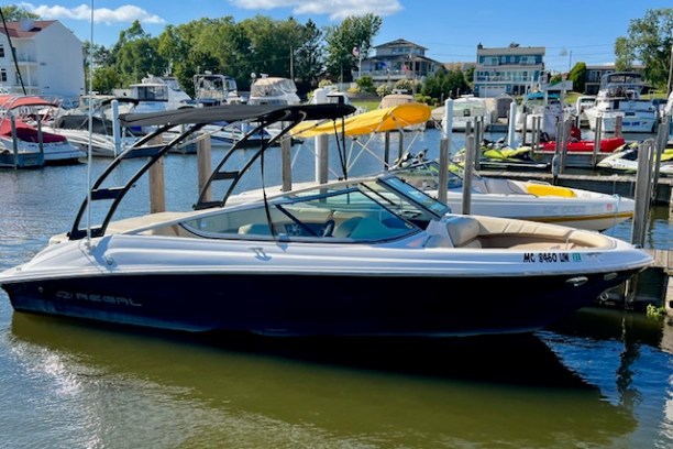 a boat is docked next to a body of water