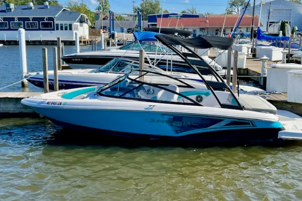 a boat is docked next to a body of water