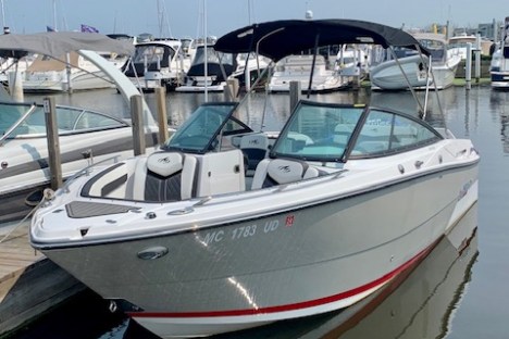 a boat is docked next to a body of water