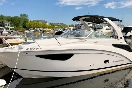 a boat is docked next to a body of water