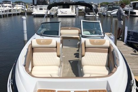 a boat sitting on top of a car